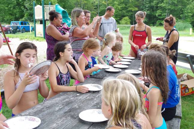 The bobbing for M&amp;Ms covered with whipped cream contest is one of the kids&#xfe;&#xc4;&#xf4; favorite parts of the water carnival.