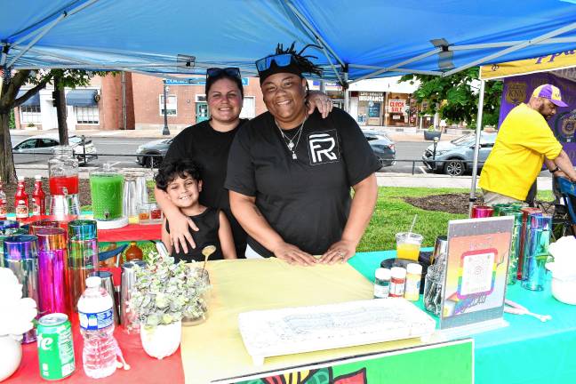Juneteenth: Celebrating freedom and unity Aaron Hernandez, Rebecca Messler and Brittney McKlin, all of Stroudsburg, Pa., promote Flooid Reserve Mobile Bartending. (Photo by Maria Kovic)