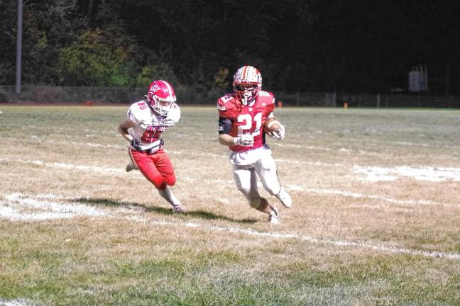 Wildcats claw Patriots, 35-6 <b>High Point ball carrier Brendon Lehman is pursued by Lenape Valley defender Jacob Alderson in the first half.</b>