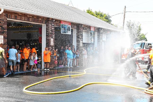 Photos: Dual wetdown in Sussex <b>Residents watch a dual wetdown at the Pochuck Valley Volunteer Fire Department in Sussex.</b>