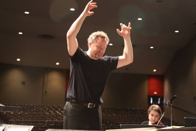VTHS orchestra collaborates with N.J. symphony Jeffrey Grogan and Sarah McGuire are shown on violin.
