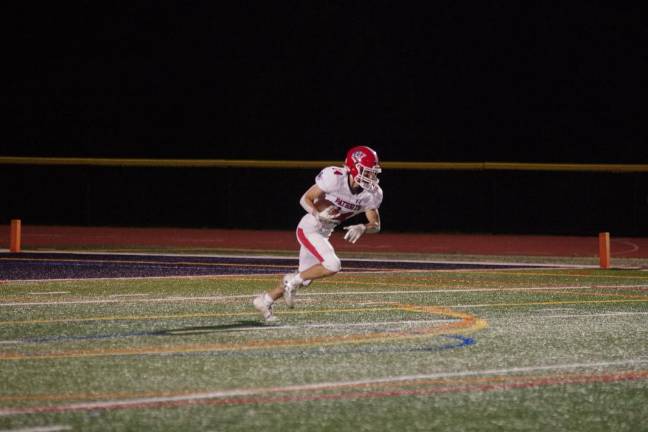 Newton leads division Lenape Valley kick returner David Kraus on the move in the first half.