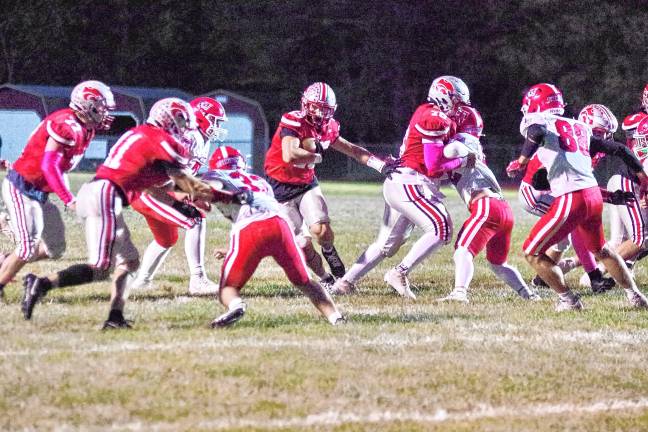 Wildcats claw Patriots, 35-6 <b>FB2 High Point quarterback Jerron Martress carries the ball through an opening in the Lenape Valley defensive line. He rushed for 189 yards and made three touchdowns. (Photos by George Leroy Hunter)</b>