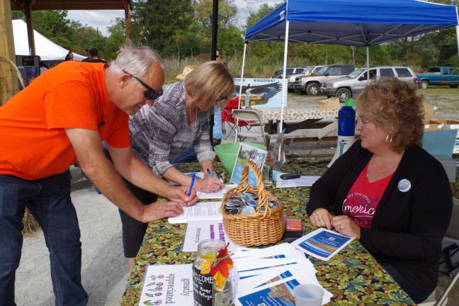 William and Lyle Gerbracht of Westtown, N.Y., signed up to be Friends of the Wallkill River National Wildlife Refuge. Signing them up was refuge volunteer and Wantage resident Diane Ross.