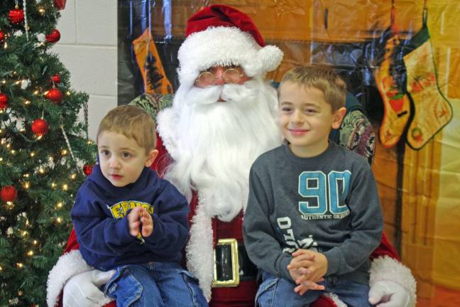 VTHS hosts Breakfast with Santa Brothers Gio, 3, and Domenic Papaleo, 8, of Vernon pose with Santa Claus. Vernon resident.
