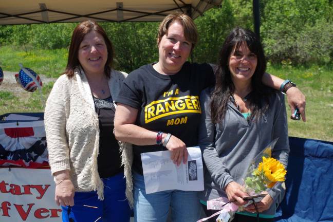 At The Military Moms of Vernon tent is Vernon resident Janice Colvin, and Linda Smigen and Kim Ryan, both of Barry Lakes. They are preparing care packages to be shipped overseas.