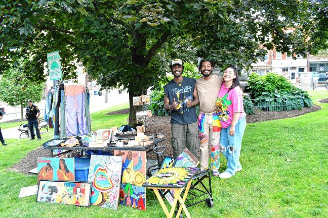 Juneteenth: Celebrating freedom and unity Robert and Arman Brown of North Plainfield show off the T Cozy brand clothing with Donna Sanchez of New Brunswick. (Photo by Maria Kovic)