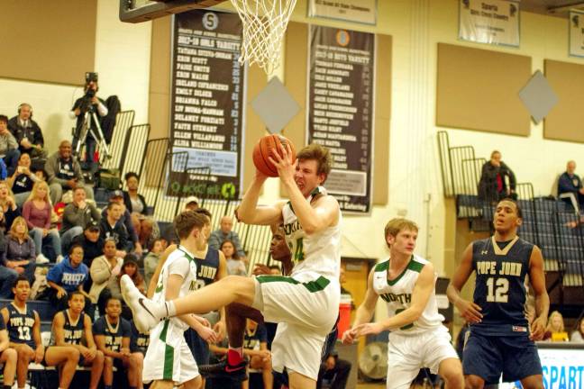 North Hunterdon's Paul Woolhouse comes down with the ball during a rebound in the third period. Woolhouse grabbed 18 rebounds.