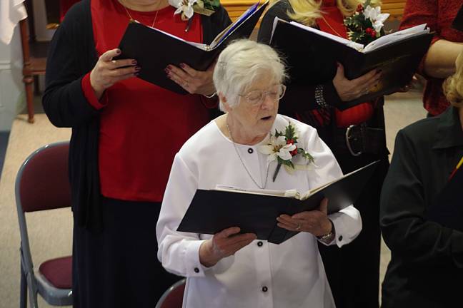 Choral Society performs at St. Thomas church 2011 Vernon Senior of the Year Terri Van Emburgh sings during the Community Choral Society's winter concert, entitled "Sing a Glad Noel" on Sunday. She was also recognized for her generous contributions to the society.