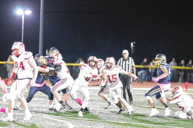Football roundup: Vikings slay Wildcats, 35-28 <b>High Point quarterback Jerry Empirio is about to throw the ball in the second half. He made one touchdown and passed for 120 yards.</b>