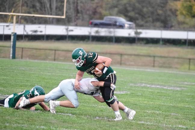 Wildcats claw Patriots, 35-6 <b>FB4 Sussex Tech ball carrier Gavin Mericle is tackled by a Kittatinny defender. He made one touchdown.</b>