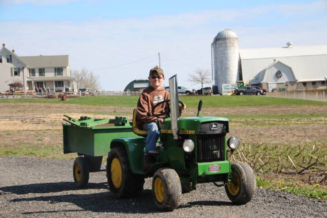 Reiss Little of Wantage on his green John Deere ready to help plow the fields. (2)