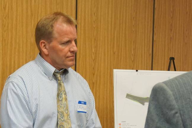 DOT to replace bridge in Sussex Borough Photo by Vera Olinski N.J. Dept. of Transportation consultant Bernie Boerchers listens to a Wantage resident's question.