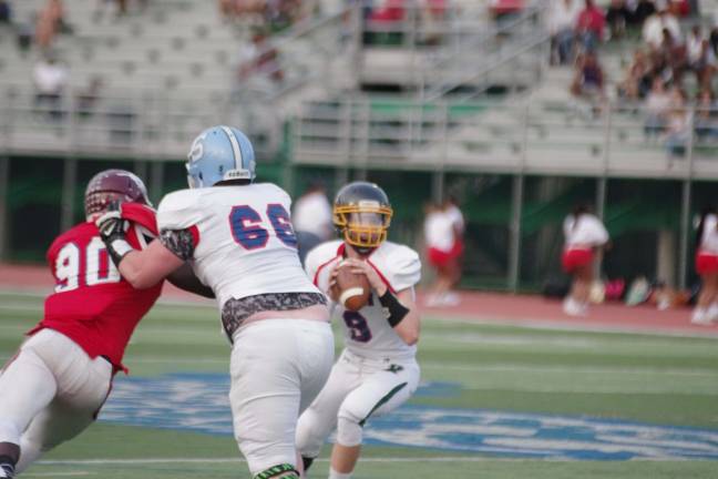 Local football players compete in all-star classic West offensive lineman Jake Vogel #66 (Sparta) protects quarterback Aaron Furnbach #9 (West Milford).