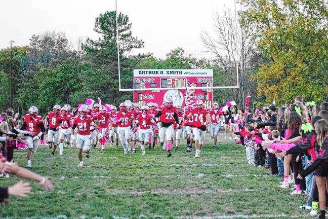 Wildcats claw Patriots, 35-6 <b>The High Point Wildcats charge onto the field before the start of the game. Their record is 6-1.</b>