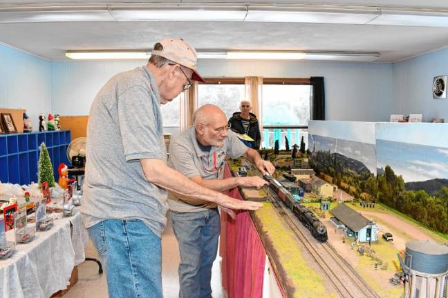 Photos: Holiday Train Display Sussex County Railroad Club members Noel Phillips, left, and Dave Rutan set up the model train displays.