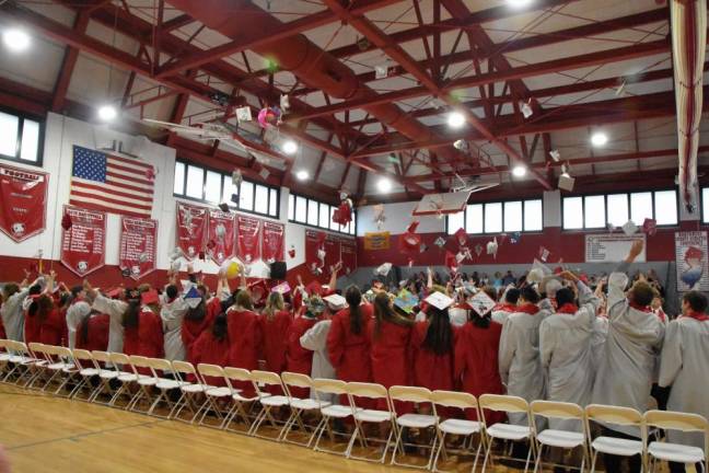 Members of the High Point Regional High School Class of 2023 throw their caps in the air at graduation. (Photo courtesy of Island Photography)