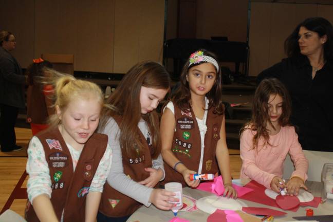 Family Volunteer Day brings out community Left to right McKenzie Emanuel, Mac Kenzie Genund, Cathy Biederman and Catherine Marssich.