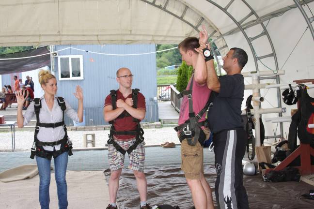 Not a bird, not a plane ... Scuba Joe, the tandem instructor at Sussex Airport, goes over the jumping and landing instructions one more time. Photo by Gale Miko