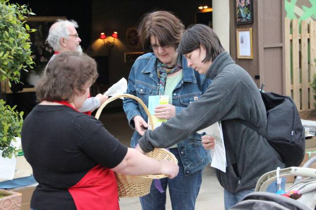Volunteers handing out seed packets to the visitors of Springfest.