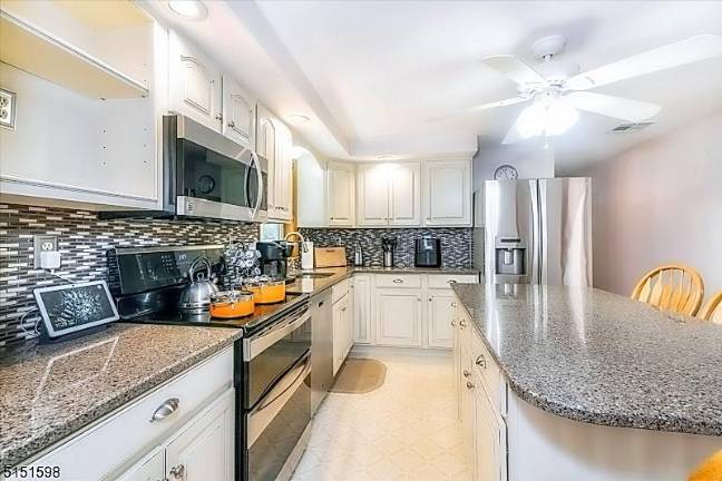 Private splendor in intimate lake community 63 Beaver Run Road