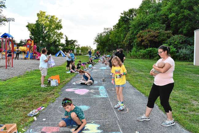 Photos: Sidewalk Chalk Art Festival in Vernon <b>Residents draw on the walk during the Sidewalk Chalk Art Festival on Thursday, Aug. 14 at Maple Grange Park in Vernon. (Photos by Maria Kovic)</b>