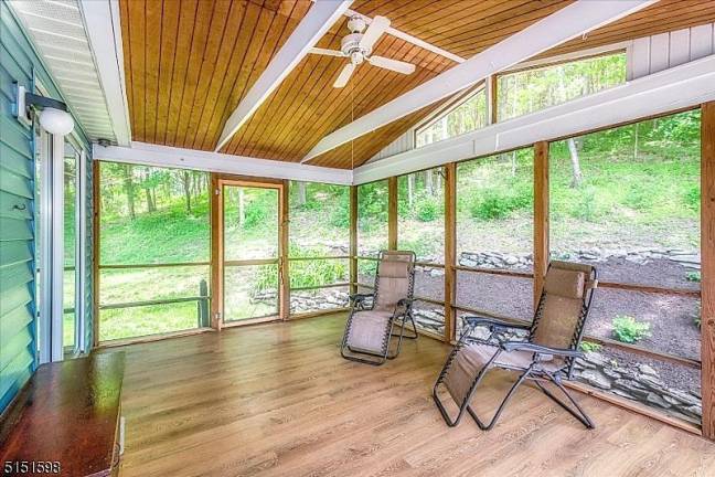 Private splendor in intimate lake community 63 Beaver Run Road