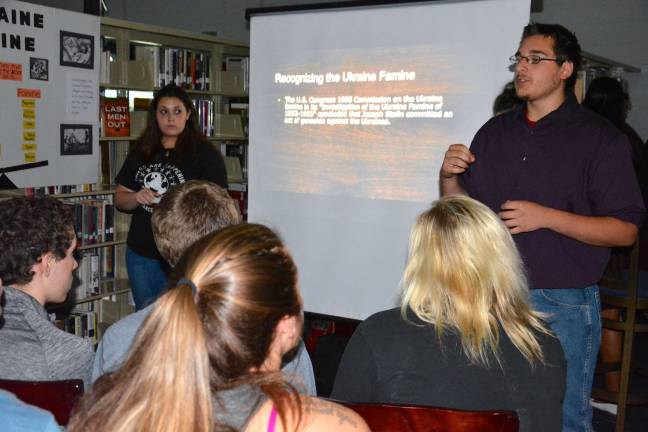Vernon students teach classmates about tolerance Spencer Veen and Dana Catalano present details of Josef Stalin's systematic starvation of the Ukrainian people in 1932-33.