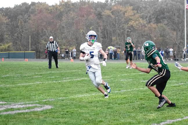 Wildcats claw Patriots, 35-6 <b>Kittatinny ball carrier Mike Strong attempts to avoid a Sussex Tech defender. He made one touchdown.</b>