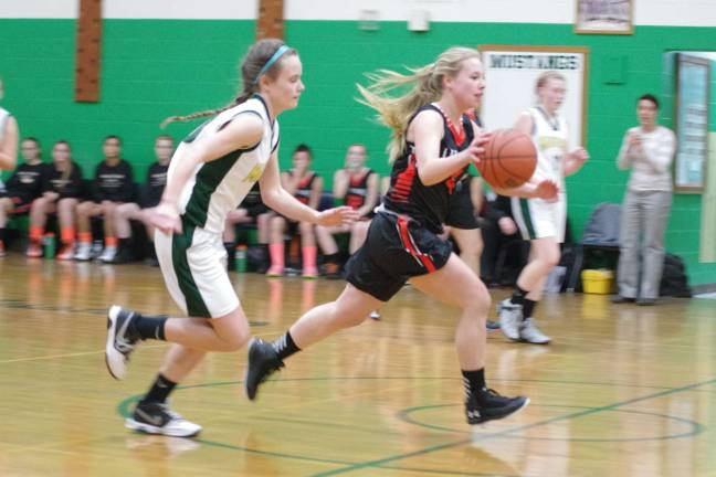 Sussex Tech's Lindsay Kopf shadows Hackettstown's Amber Sagan.