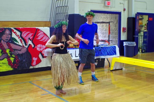 Guam native and Vernon Township High School senior Ronelle Tajalle, 17, offered instruction in authentic Polynesian dancing at the Vernon PAL Annual Cultural Day hosted by the Vernon PAL Youth Leadership Council. Here she is shown with junior Daniel Donofrio-DeVries.