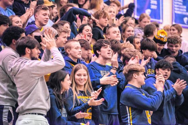 Vernon Township High School students applaud the team.