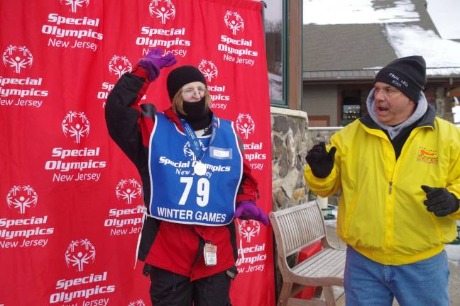 Vernon Mountaineers perform at Special Olympics Teresa Kelly of Franklin is shown after she was awarded a gold medal in the Super G by Chief Robert Belfiore. The chief is retired from the Port Authority Police Department and is a resident of Jersey City. Kelly was first in both intermediate slalom and intermediate Super G.