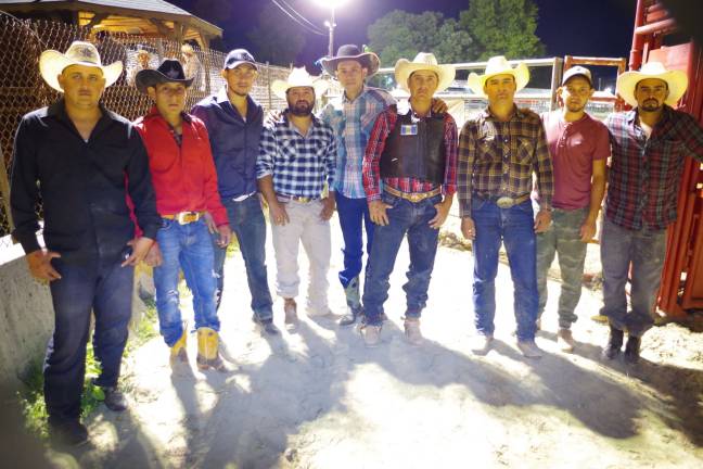 A group of Latino rodeo cowboys pose for a portrait. Latin America has a rich rodeo history.