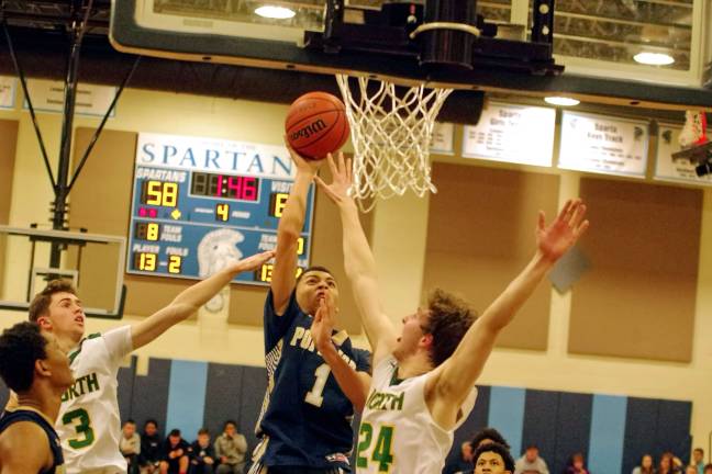 Pope John's DiAndre South raises the ball towards the hoop in the fourth period. South scored 15 points.