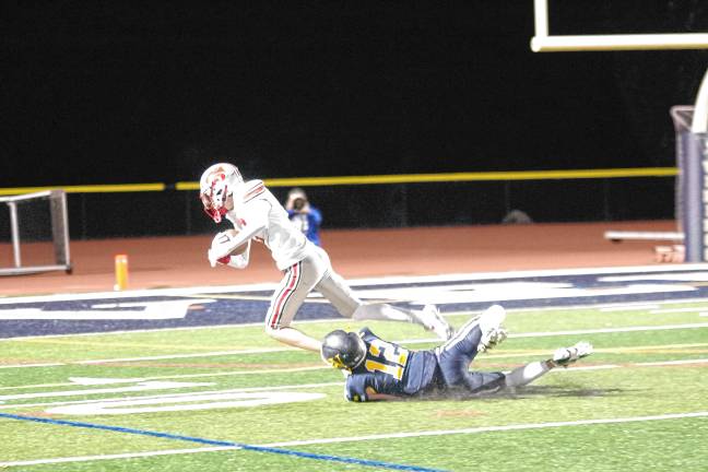 Football roundup: Vikings slay Wildcats, 35-28 <b>After catching the ball, High Point wideout Mark Leach is brought down by Vernon cornerback James Curry in the fourth quarter. </b>