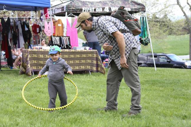 Aidan and Austin D'Almeida of Sussex try out the hand made hula hoops at the Medicine Wheel on Saturday.