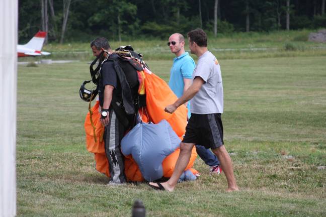 Not a bird, not a plane ... Back to the hanger to refold the parachute. Photo by Gale Miko