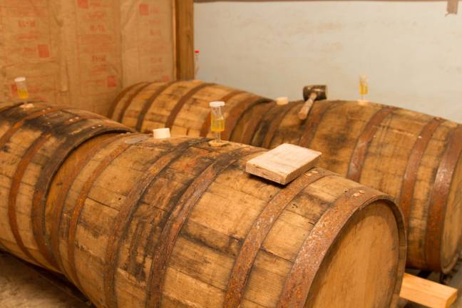 Whiskey barrels inside the fermentation chamber.