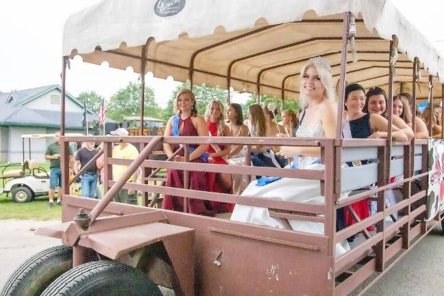 The fairest of the fair Queen of the Fair contestants take a ride through the fair before the pageant (Photo by Sammi Finch)