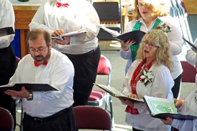 Husband and wife team John and Jayne Verdonik of Highland Lakes are shown singing during The Community Choral Society&#x2019;s annual winter concert at St. Thomas&#x2019; Episcopal Church in downtown Vernon.