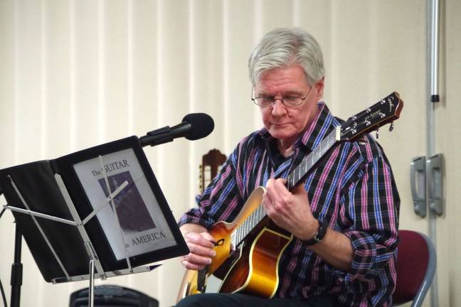 Guitarist/composer Peter Griggs is shown during his Saturday evening presentation of &#xfe;&#xc4;&#xfa;The Guitar In America&#xfe;&#xc4;&#xf9; at St. Thomas&#xfe;&#xc4;&#xf4; Episcopal Church in Vernon.