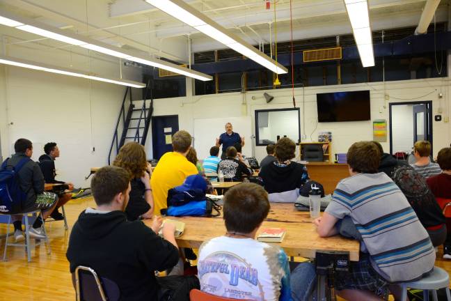 Construction management students draw up plans