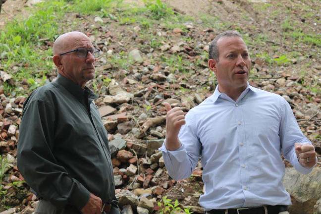 Gottheimer calls on EPA to intervene in Vernon U.S. Rep. Josh Gottheimer, right, assesses the waste pile alongside Vernon Mayor Harry Shortway, Jr. left. In the background, rebar, cement, asphalt, and rusted piping can be seen mixed in among the waste.