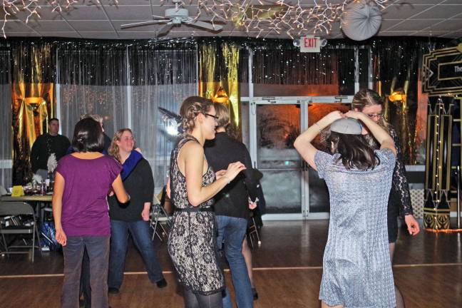 Barry Lakes hosts annual evening out The dance floor included several women wearing flappers, which were common in the 1920s. The ladies spent more time on the dance floor than the gentlemen.