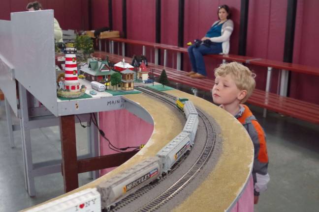 What kid doesn't love a train? Visiting from Chester, Edward Joseph, 5, watches as the trains roar by his eyelevel vantage point.