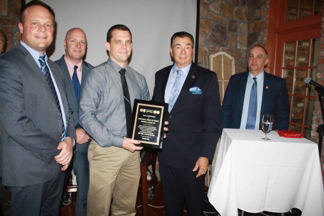 Responders support group presents scholarships From left, Sparta Police Chief Neil Spidaletto, Sparta Det. Lt. Terrence Mulligan, FOP president Thomas Snyder of the Sparta PD, with Pat Aramini and Tony Torre of The 200 Club. Photos by Rose Sgarlato