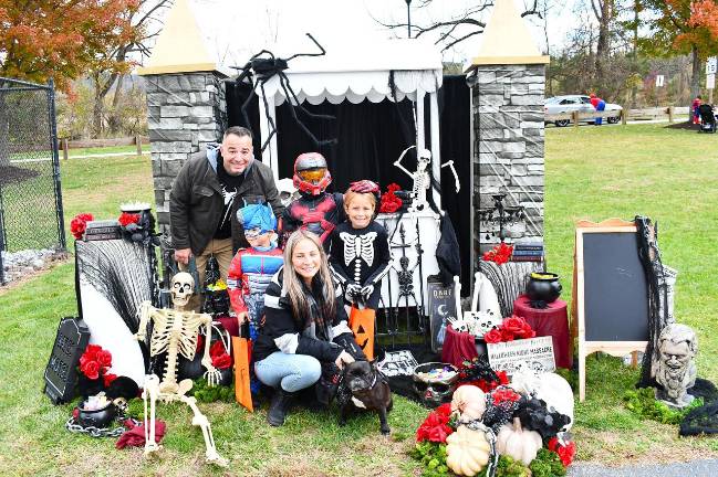Vernon holds trick or trail event <b>Kris, Jocko, Jessica Bronson and Tahlia Kabashi are shown with their dog, Chili.</b>