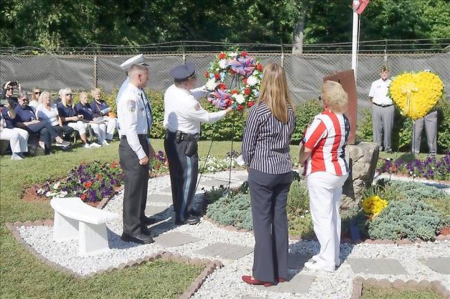 Police Chief Steven Pittigher places the wreath on the 9/11 Memorial (Photo by Vera Olinski)