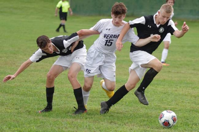 Wallkill Valley's Tony Ciapara and Skylar Hanisch try to box in Vernon's Nolan Shade while pursuing the ball.